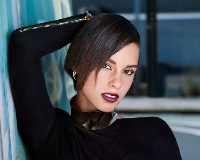 Woman with short dark hair and dark lipstick
