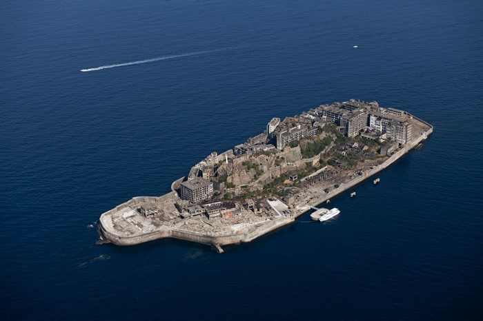 Aerial view of Gunkan Jima, Japan, with boats in the ocean