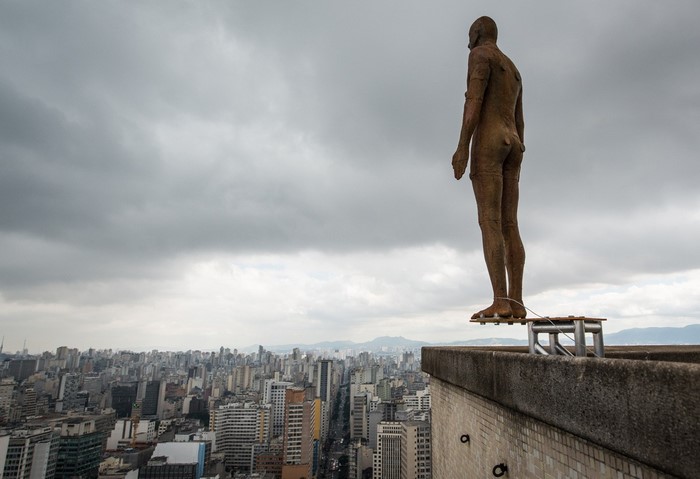 Statue overlooking S o Paulo cityscape