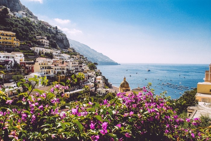 Positano town on a cliff overlooking the sea with flowers