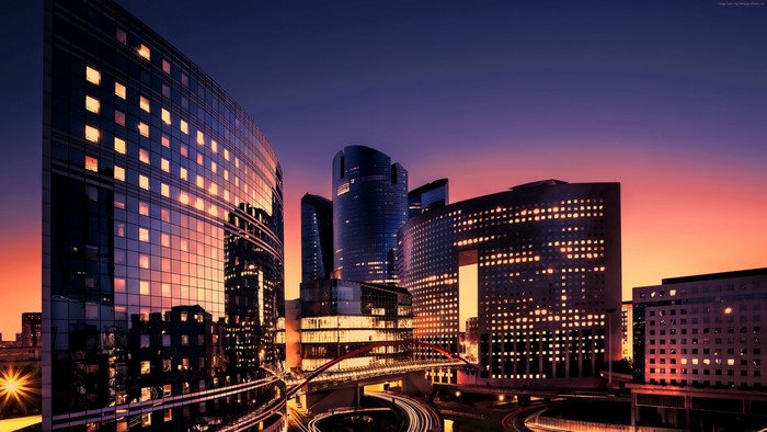 Cityscape of La Defense Paris at sunset with skyscrapers