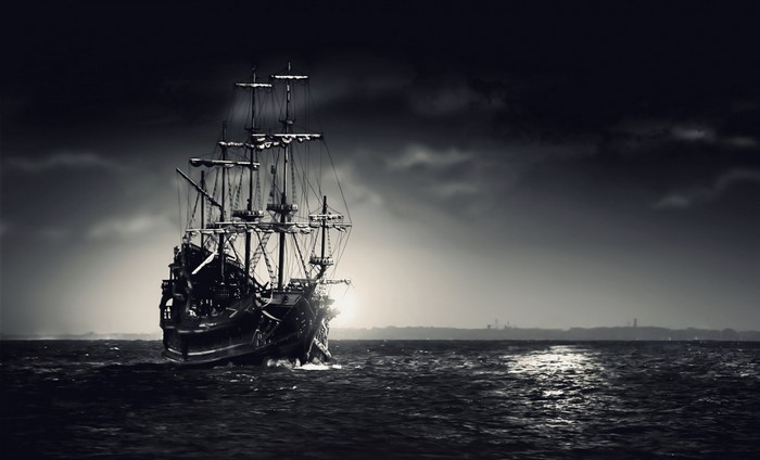 A ghost ship sailing on a dark, stormy sea