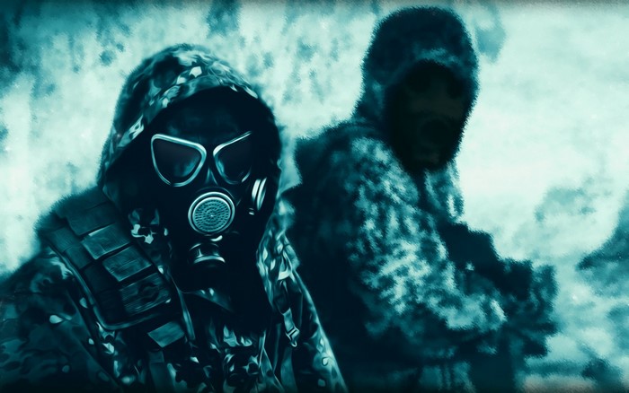Two soldiers in gas masks and camouflage