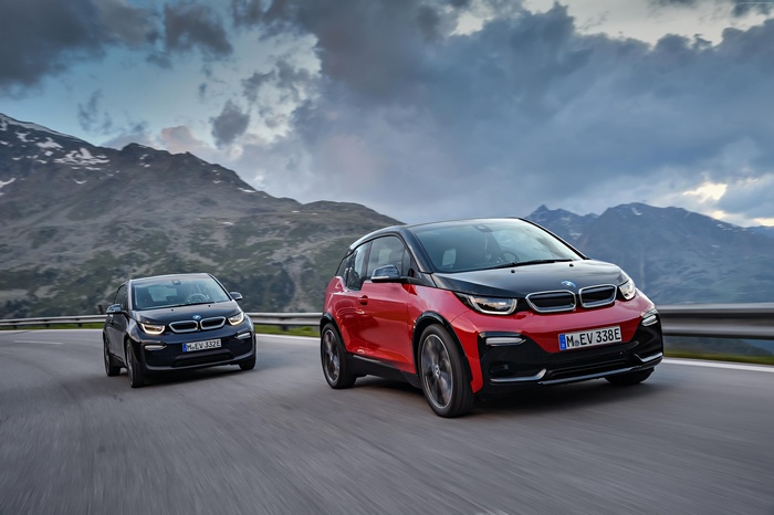 Two BMW i3s electric cars on a mountain road