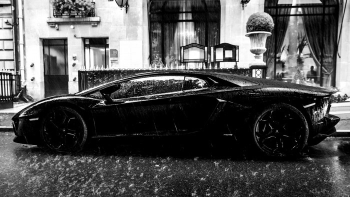 Black Lamborghini Aventador in the rain
