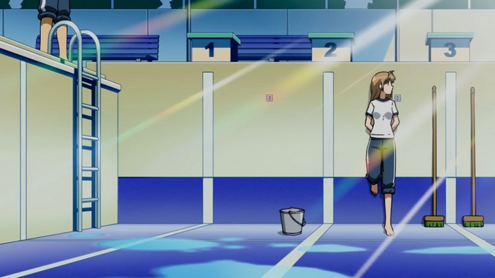 Girl in gym with brooms and bucket