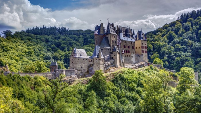 Eltz Castle Surrounded by Forested Hills in Germany