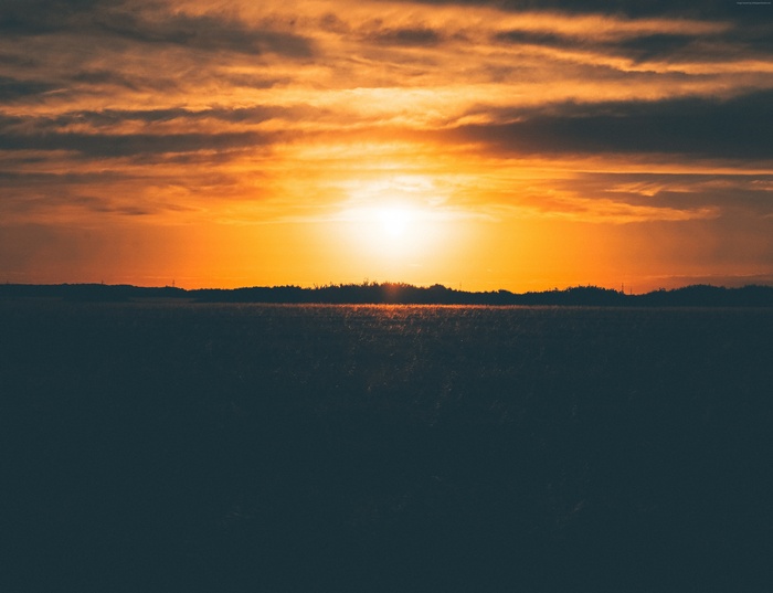 Sunset over a dark field