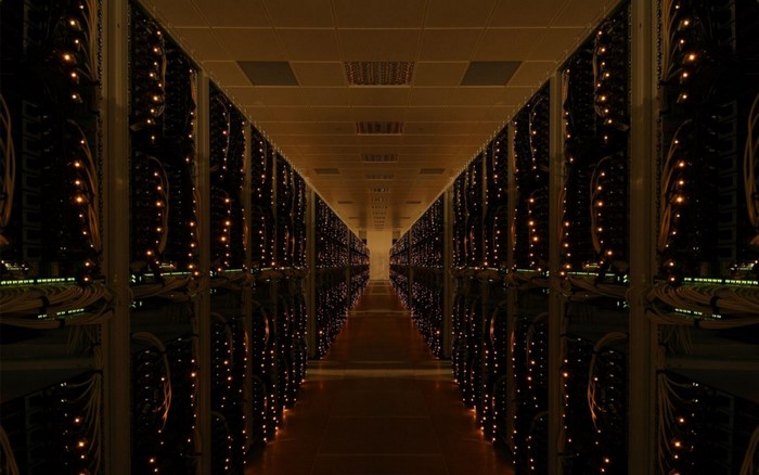 Server room with rows of illuminated racks