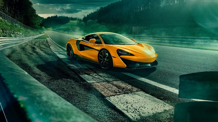 Yellow McLaren 570S on a race track