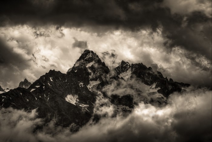 Mountain peaks shrouded in clouds