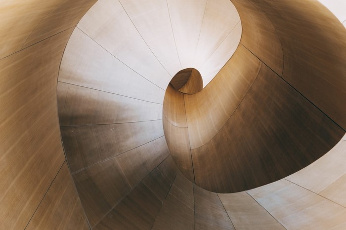 Abstract spiral architecture with wood-like texture
