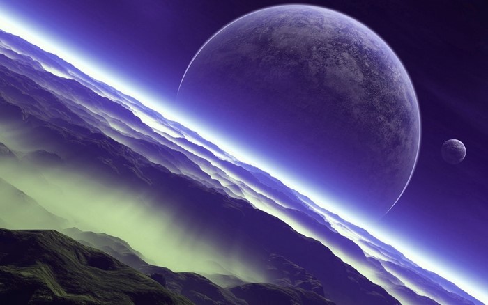 Planet and moon in outer space over misty mountains