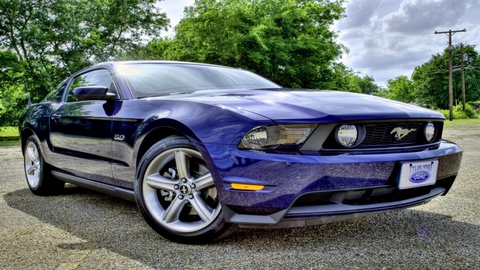 Blue Ford Mustang GT parked outdoors