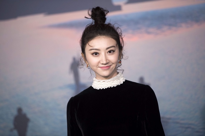 Tian Jing in black dress with white collar