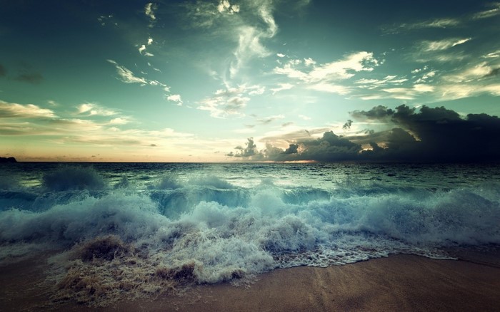 Dramatic Sunset Over Ocean Waves