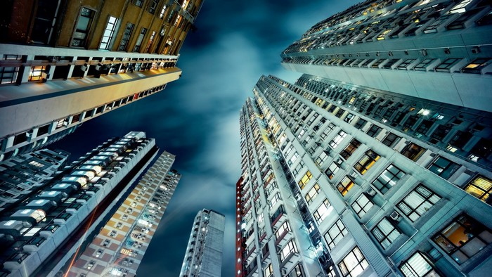 Skyscrapers at night with clouds