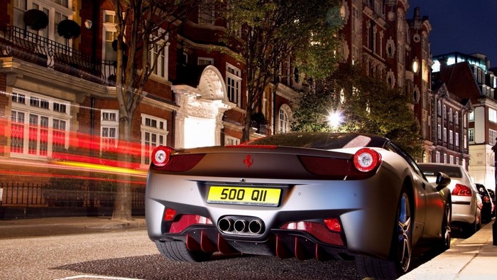 Ferrari 458 Italia parked on a street at night