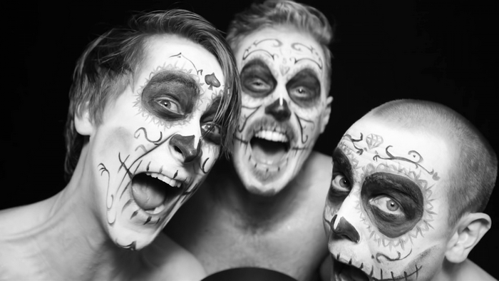 Three men with skull face paint