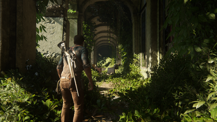 Nathan Drake from Uncharted 4: A Thief's End in overgrown ruins