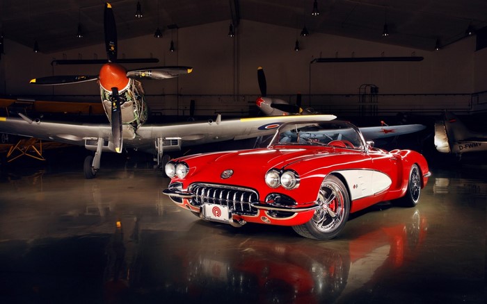 Red Chevrolet Corvette Vintage Sports Car in Hangar