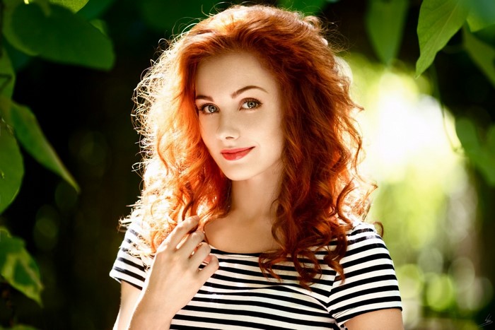 Portrait of Smiling Redhead Woman Outdoors