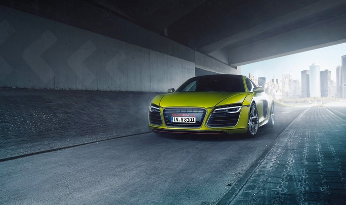 Lime green Audi R8 Quattro sports car under a bridge