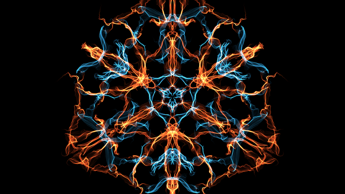 Symmetrical fractal pattern of orange and blue light