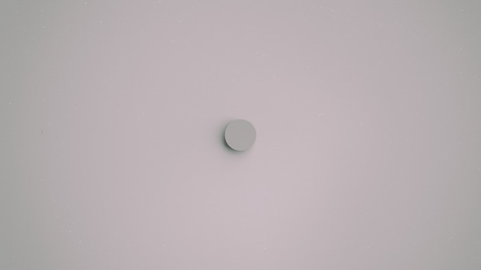 A simple gray circle on a light gray background