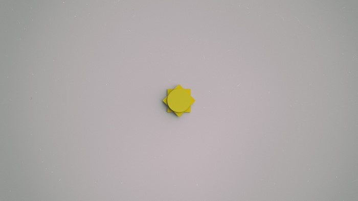 Yellow sun shape on a white background