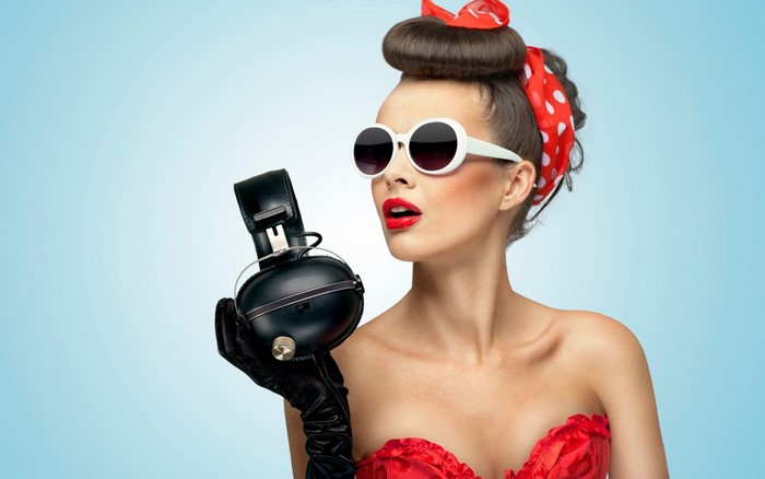 Woman in vintage style with headphones and sunglasses