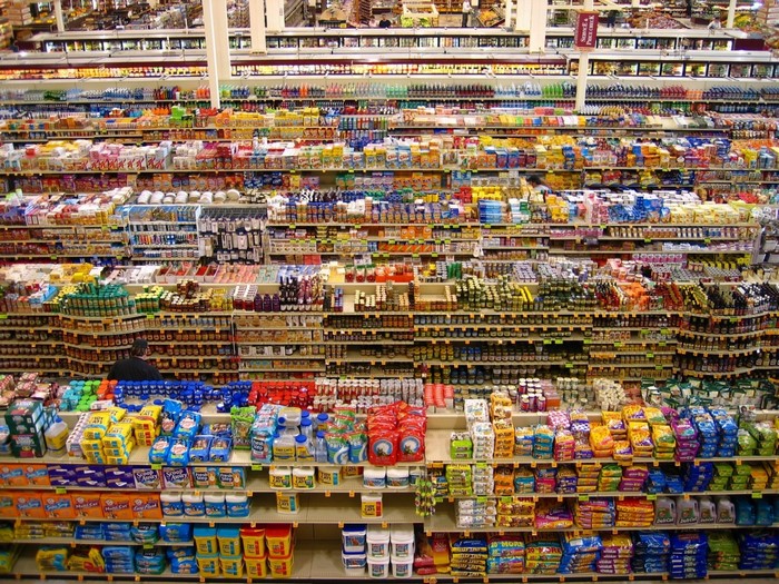 Supermarket aisle stocked with groceries and food products