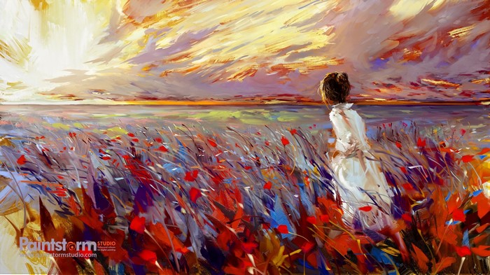 Woman in white dress in a field of flowers at sunset