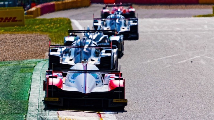 Race cars on a track during a race