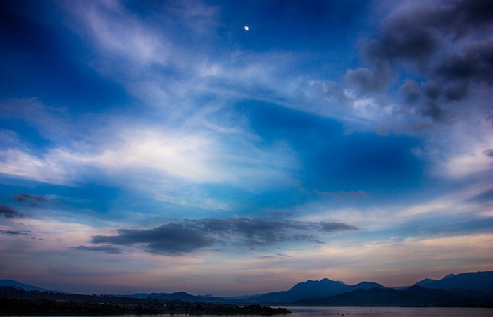 Moonlit Sky Over Mountains and Water