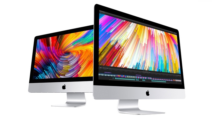 Two Apple iMac computers with colorful screens