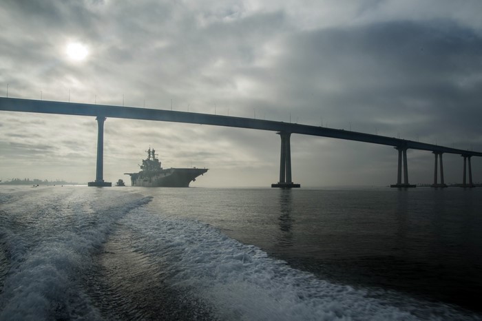 Amphibious assault ship passing under Coronado Bay Bridge