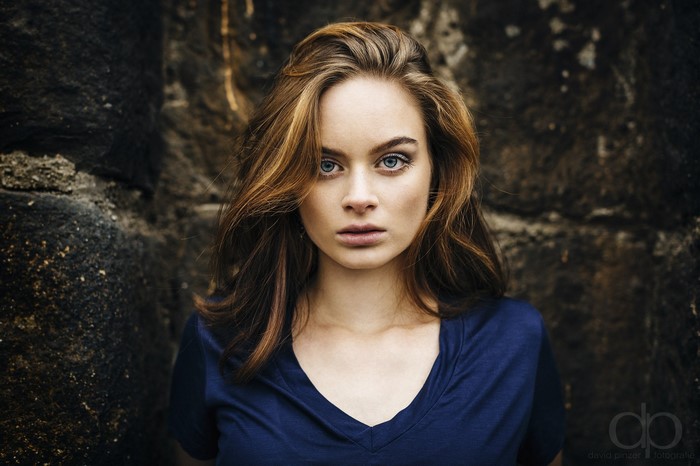 Woman with long brown hair and blue eyes