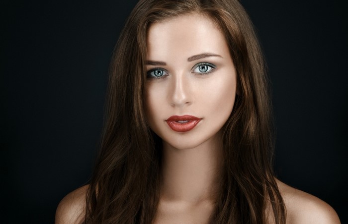 Woman with brown hair and blue eyes