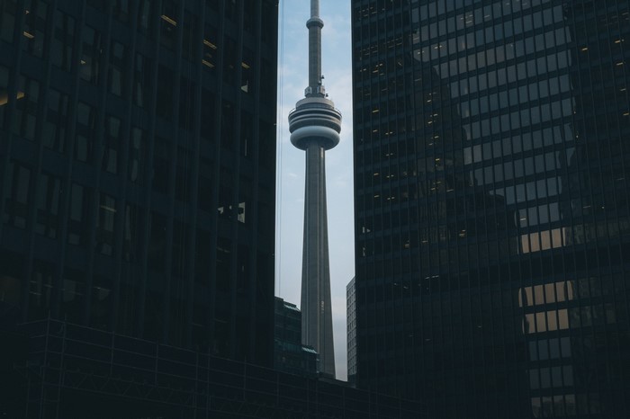 CN Tower between skyscrapers in Toronto