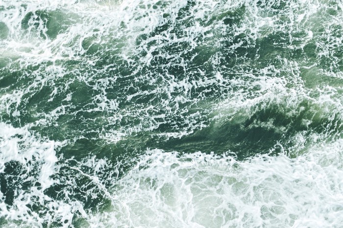 Ocean waves with white foam