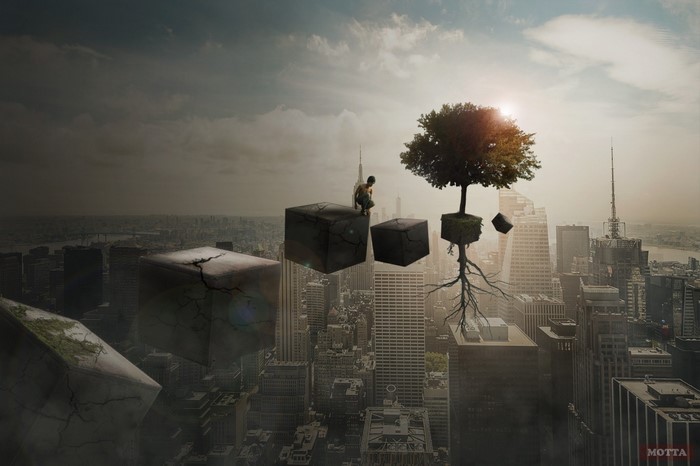 Man on floating cubes with tree over cityscape
