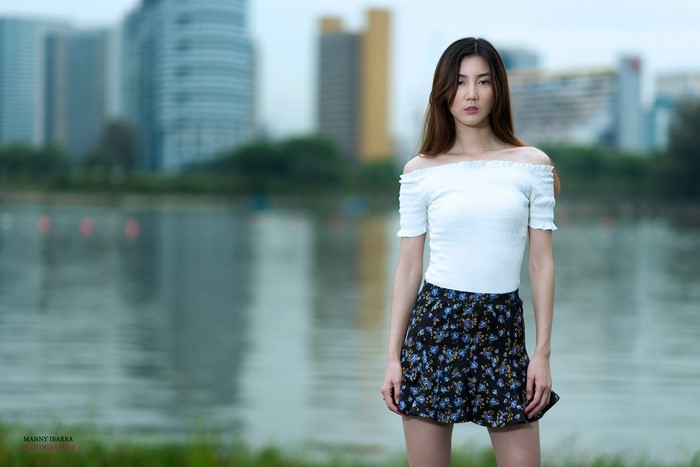 Brunette Woman in White Shirt by the Water