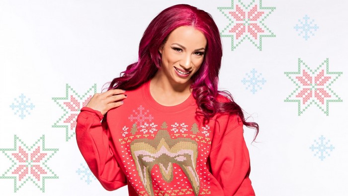 Sasha Banks from WWE wearing a Christmas sweater