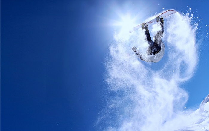 Snowboarder performing a jump in the air