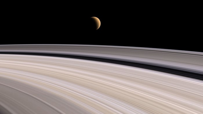 Saturn's rings with a crescent moon