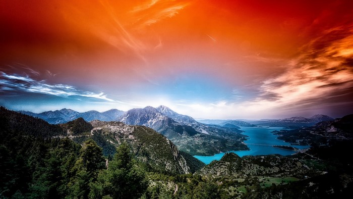 Mountain landscape with lake and dramatic sky