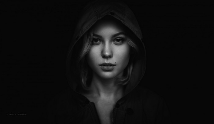 Monochrome portrait of a woman in a hood
