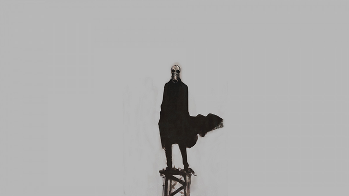 Man in gas mask standing on structure