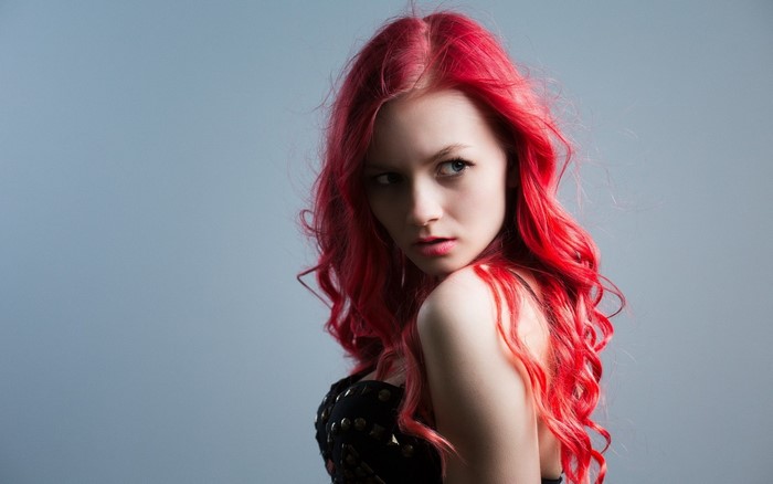 Portrait of Woman with Vibrant Red Curly Hair